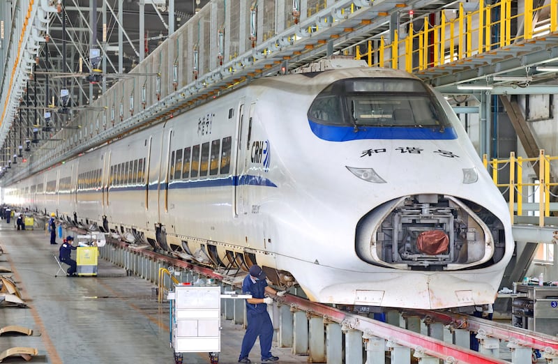 Workers maintain a high-speed train at Nantong High-Speed Train Depot in Jiangsu province in eastern China, on June 29th, 2026. Photograph: CN-STR/AFP via Getty Images/China Out