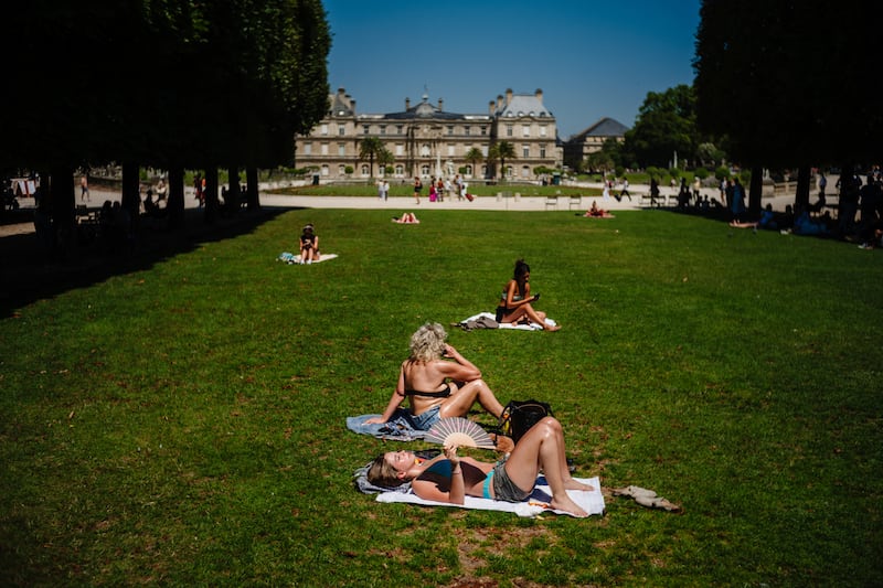 People sunbathe in the Jardin du Luxembourg in Paris on Monday. Photograph: by Dimitar Dilkoff/AFP/Getty
