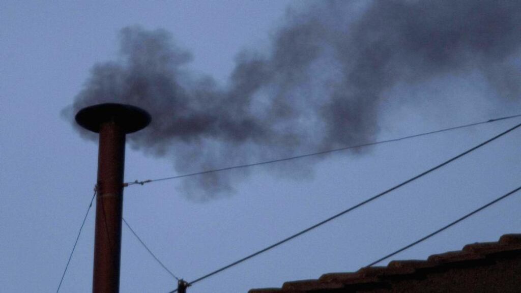 Black smoke is seen rising from the roof of the Sistine Chapel indicating that the College of Cardinals have failed to elect a new Pope on April 18th, 2005 in Vatican City. Photograph:  Peter Macdiarmid/Getty Images