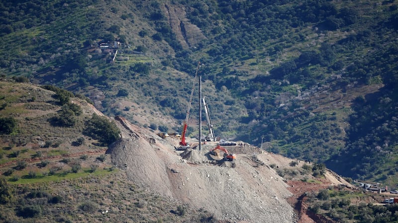 A crane removes steel tubes after failing to place them into the drilled well. Photograph: Reuters/Jon Nazca