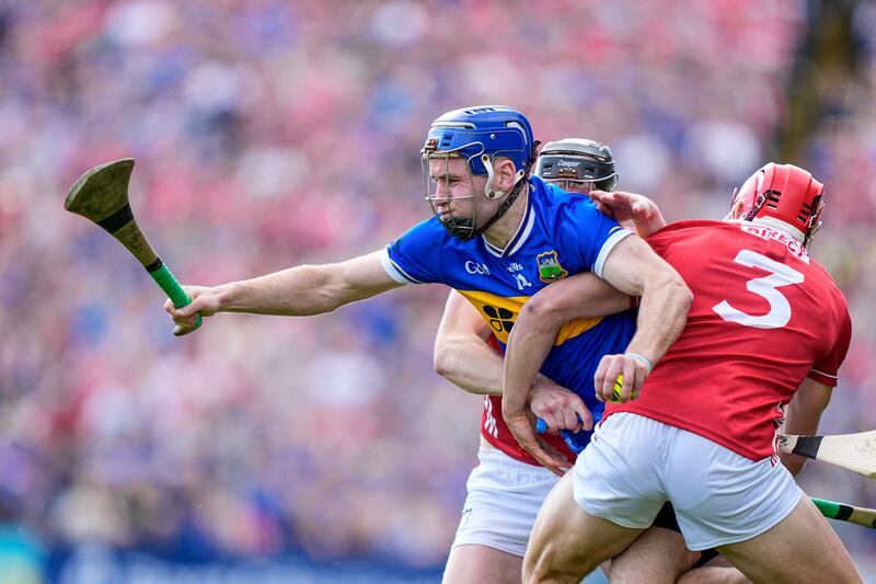 John McGrath of Tipperary in action against Ciarán Joyce of Cork. Photograph: James Lawlor/Inpho