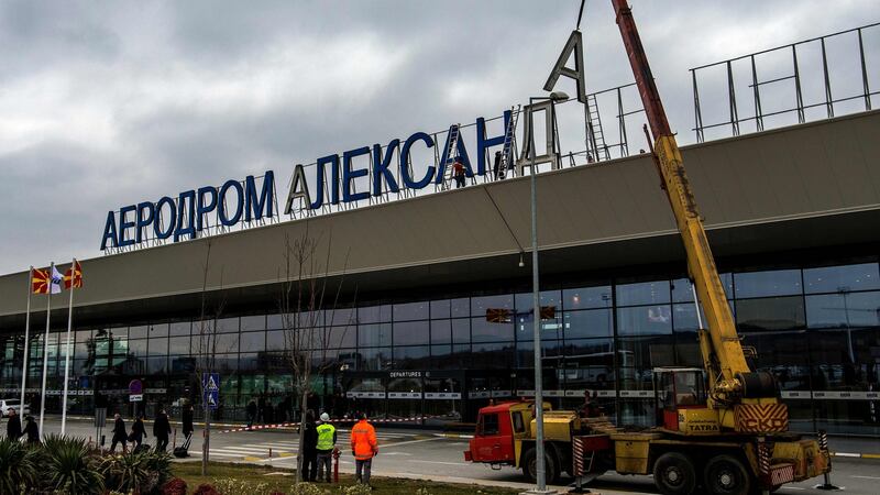 Workers remove the cyrillic letters spelling out the name of the airport named after Alexander the Great, on the outskirts of Skopje, Macedonia, in February. File photograph: Robert Atanasovski/AFP/Getty Images
