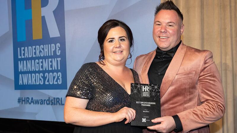 Ciara Connolly, director of commercial recruitment, Excel Recruitment, presents the best employer branding programme award to David Nally, Woodie’s