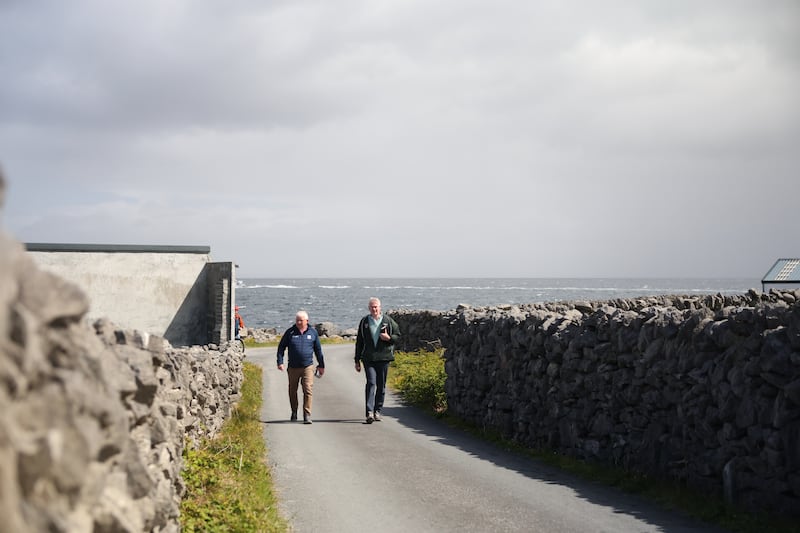 Cllr Padraig Mac An Iomaire joins Seán Kyne on the campaign trail on Inis Oírr. Photograph: Enda O'Dowd