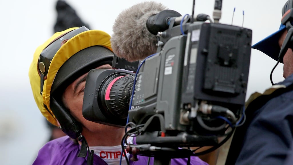 Davy Russell kisses a TV camera after winning a race during the 2015 Cheltenham Festival. Photograph: Dan Sheridan/Inpho