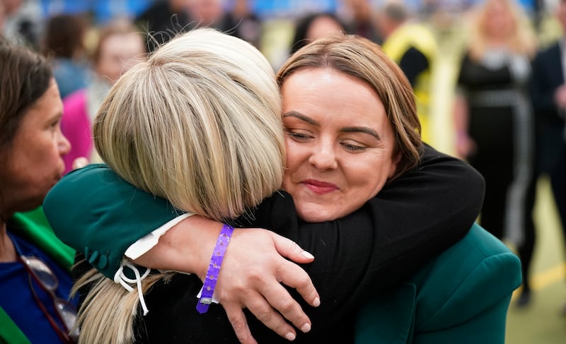 Kathleen McGurk of Sinn Féin hugs party deputy leader Michelle O'Neill as she concedes defeat in East Derry. Niall Carson/PA Wire 