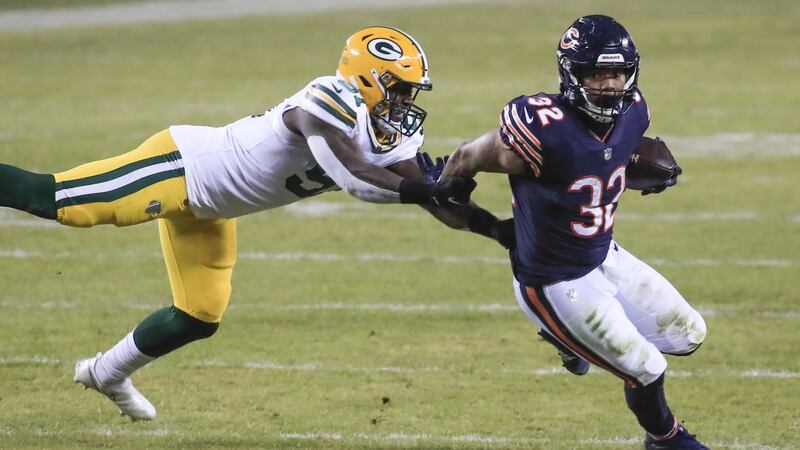 Chicago Bears running back David Montgomery (R) tries to evade Green Bay Packers inside linebacker Krys Barnes. Photograph: Tannen Maury/EPA