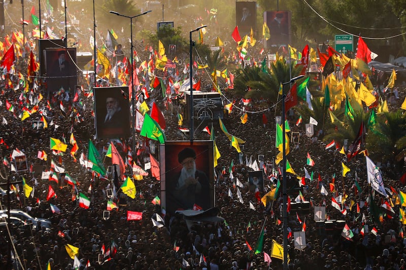 Crowds of mourners gather around an unseen vehicle transporting the coffin of Iran's slain supreme leader Ali Khamenei during a funeral procession in Najaf on Tuesday. Photograph: Murtaja Lateef/AFP via Getty Images