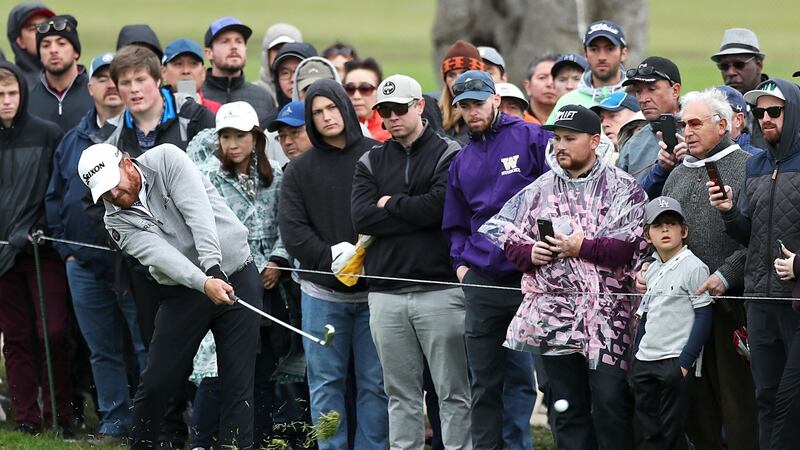 JB Holmes plays his approach to the second hole. Photo: Yong Teck Lim/Getty Images