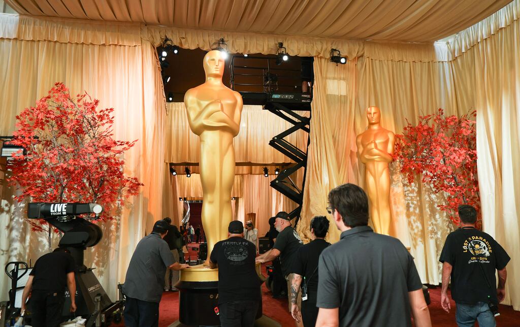 Academy Awards 2026: workers erect an Oscar statue outside the Dolby Theatre in Hollywood. Photograph: Angela Weiss/AFP via Getty