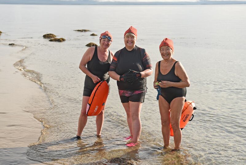 Maria O’Grady, Lucy Love and Elfie Watson, members of the Mná na Mara swimmers, at Old Head Beach in Louisburgh, Co Mayo. Photograph: Conor McKeown