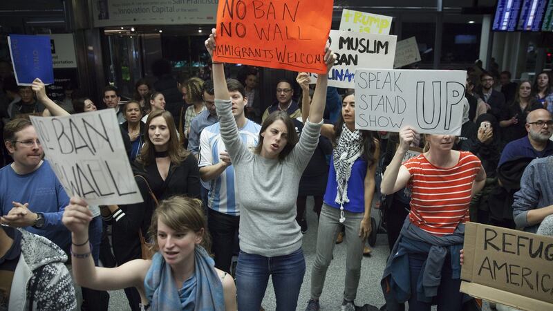 People  protest at the arrivals hall of San Francisco’s SFO International Airport after people arriving from Muslim-majority countries were held at the border control as a result of the new executive order by US president Donald Trump. Photograph: EPA