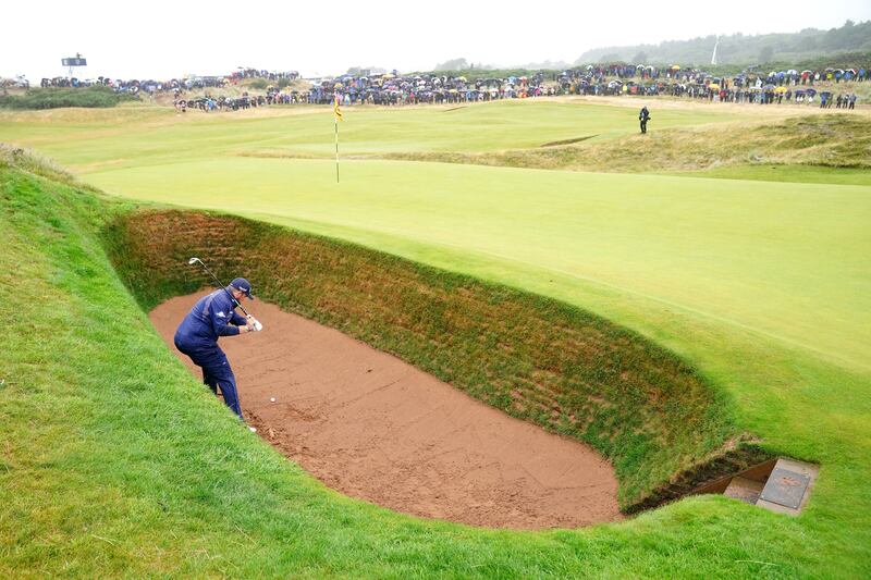 Ireland's Shane Lowry chips out of a bunker on the 8th during day three of The Open at Royal Troon. Photograph: Jane Barlow/PA