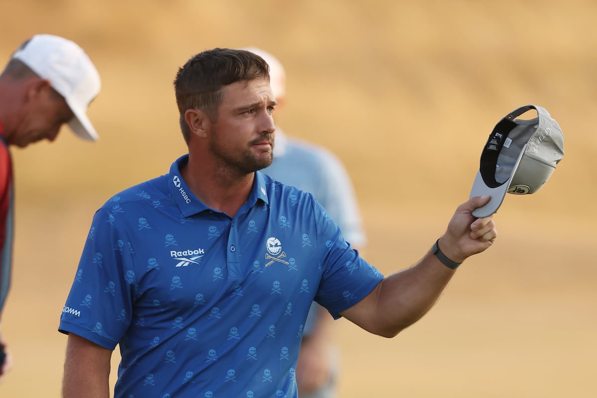 Bryson DeChambeau penalised two shots for improving his lie as Herbert leads The Open