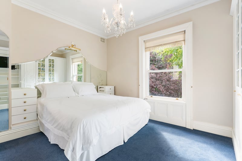 Bedroom with extensive mirrors