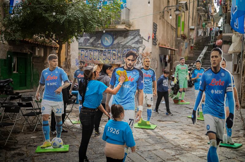 Cardboard cutouts figures of Khvicha Kvaratskhelia and other Napoli players in the Quartieri Spagnoli neighborhood in Naple. Photograph: Roberto Salomone/The New York Times