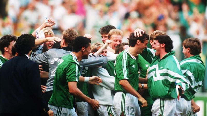 David O’Leary is mobbed by his  Republic of Ireland team-mates after scoring the winning penalty. Photograph: Billy Stickland/Inpho