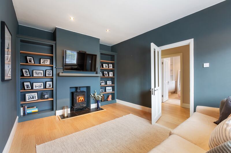 One of the four bedrooms is laid out as a livingroom