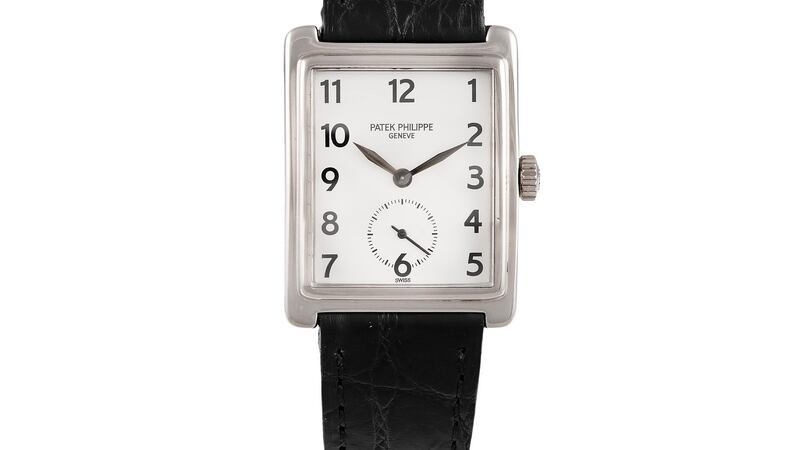 Lot 93, a Gondolo watch by Patek Philippe  with a square white face on a black leather strap