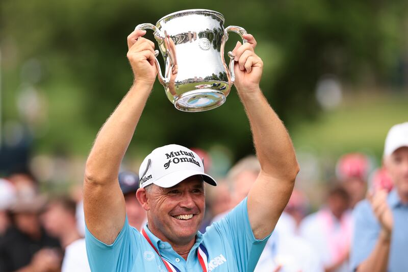 COLORADO SPRINGS, COLORADO - JUNE 29: Padraig Harrington of Ireland hoists the Francis D. Ouimet Memorial Trophy after winning the U.S. Senior Open Championship 2025 at Broadmoor Golf Club on June 29, 2025 in Colorado Springs, Colorado. (Photo by Andrew Wevers/Getty Images)