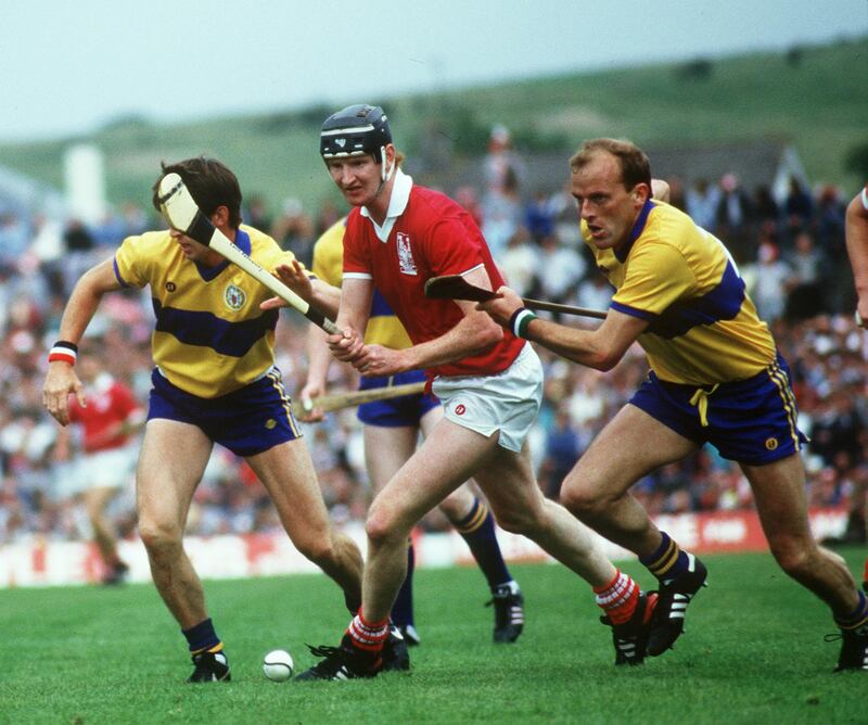 Cork's Kevin Hennessy and Ger Loughnane of Clare during the 1986 Munster final at Fitzgerald Stadium in Killarney. Cork won by three points, 2-18 to 3-12, to prolong Clare's long wait for a provincial title. Photograph: Billy Stickland/Inpho 