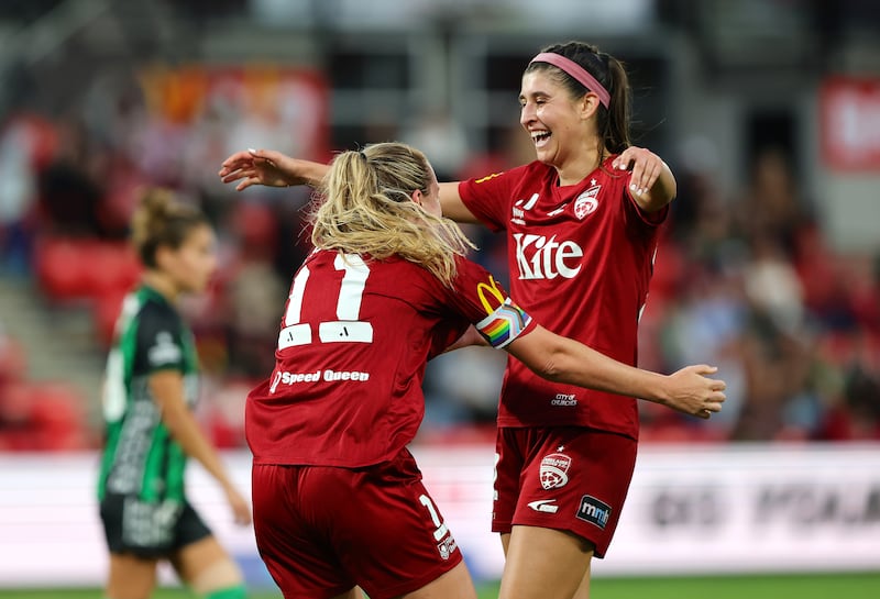 Isabel Hodgson and Erin Healy (right) celebrate Adelaide United's victory in the A-League women's elimination final match against Western United in April. Photograph: Sarah Reed/Getty Images
