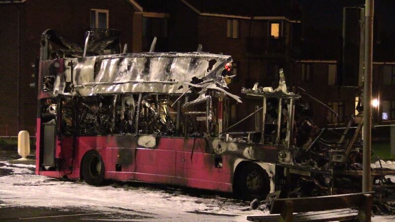 A burnt-out double decker bus on Church Road near Rathcoole in Newtownabbey, Co Antrim, after it was hijacked and set on fire near a loyalist estate. Photograph: David Young/PA Wire