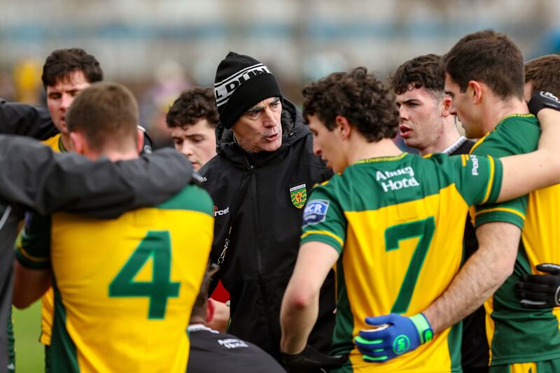 Donegal manager Jim McGuinness speaks to his players before Sunday's home league game against Mayo. Photograph: Lorcan Doherty/Inpho