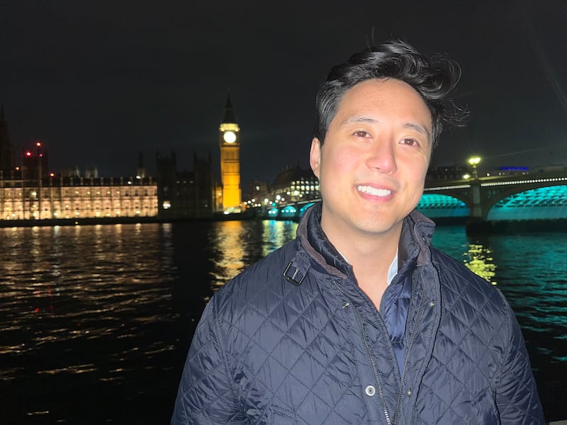 Ryan Williams, an online influencer who is known for his criticisms of Islam, standing at the river Thames as Robinson's associates tried to project onto the Houses of Parliament. Photograph: Mark Paul