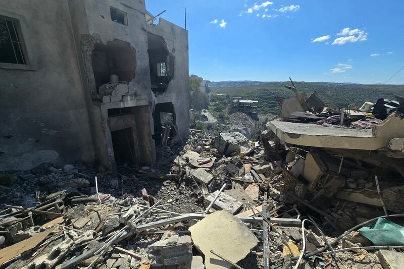 Rubble of destroyed buildings is seen at the site of an Israeli airstrike that targeted a neighborhood in the southern Lebanese village of Sir el Gharbiyeh on March 8th, 2026. Photograph: Kawnat HAJU / AFP via Getty Images