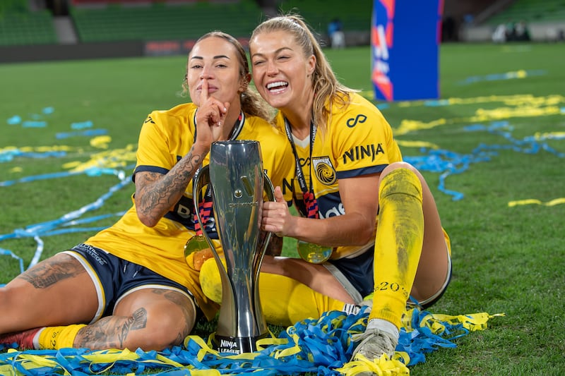 Sarah Rowe, right, with fellow Mariners player Brooke Nunn celebrate winning the A-League final against Melbourne Victory in May. Photograph: Olivier Rachon/Getty