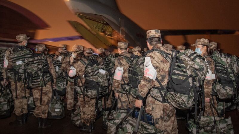 Chinese military medics arrive with medical supplies at Wuhan Tianhe Airport in Wuhan, Hubei Province, China, on Saturday. Photograph: ETA