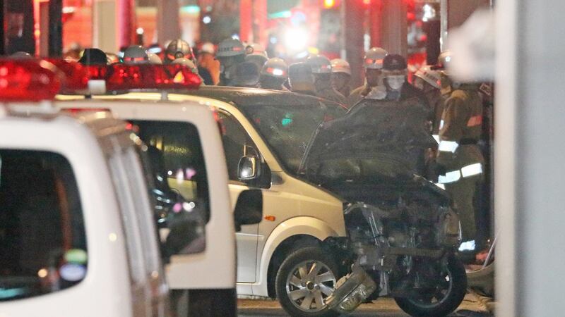 Police inspect a car whose driver rammed his vehicle into crowds on Takeshita street in Tokyo early January 1st. Photograph: AFP/Getty
