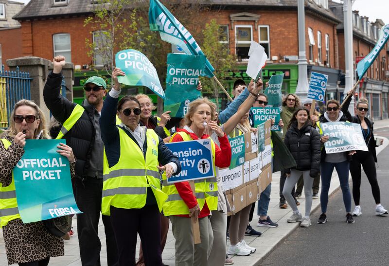 School secretaries,special-needs assistants and caretakers from St Joseph's primary school and Mount Carmel secondary school on the picket line in Marino, Dublin, last September. Photograph: Sam Boal/Collins