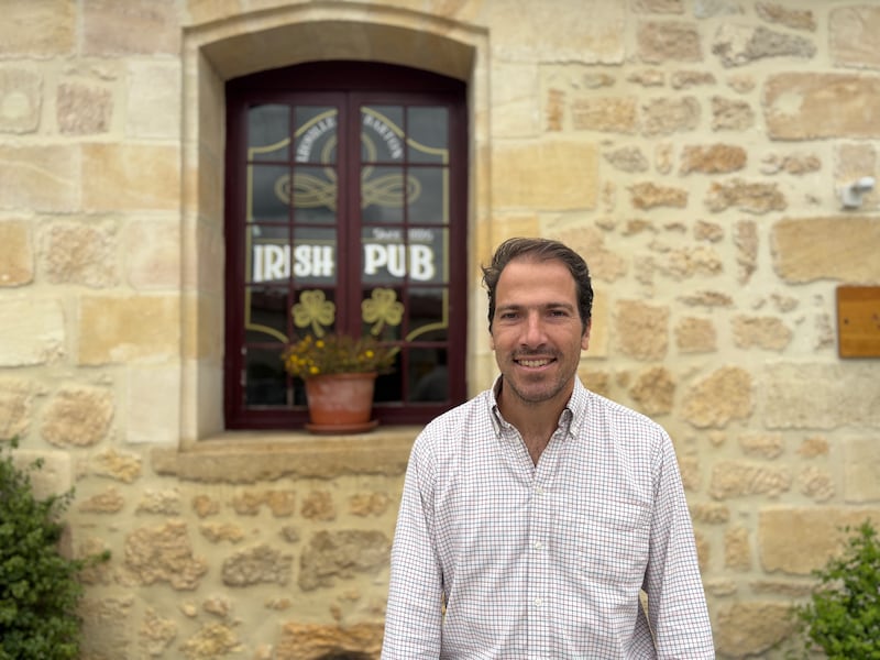 Damien Barton Sartorius outside his vineyard's 'Irish Pub' and the original family chateau next door. Photograph: Naomi O'Leary