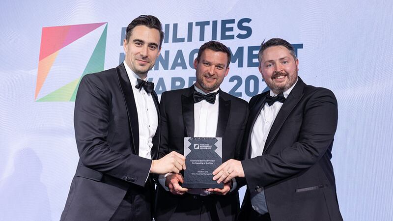 John Silke, commercial director at BAM Facilities Management, presents the client and service provider partnership of the year award to Andy Bushell, Mitie Facilities Management & Aidan McCarthy, Vodafone