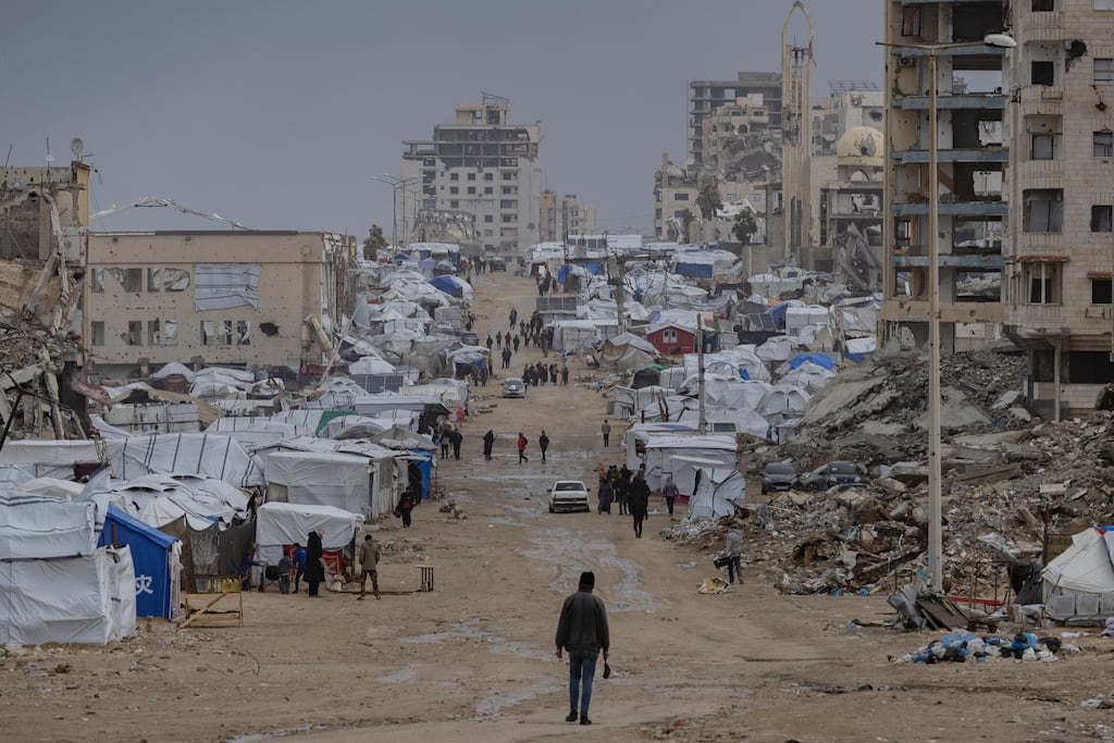 Tents of displaced people among destroyed buildings in Gaza City. Photograph: Saher Alghorra/The New York Times