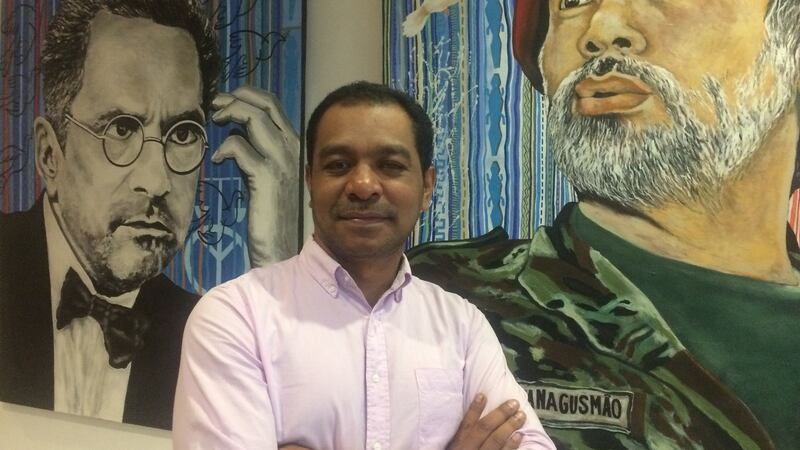 Fidelis Magalhães of Timor-Leste’s PLP party beside portraits of José Ramos-Horta (left) and Xanana Gusmão at the Hotel Timor in Dili. Photograph: Mary Boland