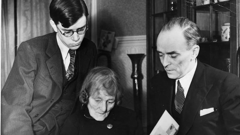 January 1948: Sean MacBride (right) with his mother Maud Gonne MacBride and his son Tiernan look over an album of photos of Troubled Times in Ireland
