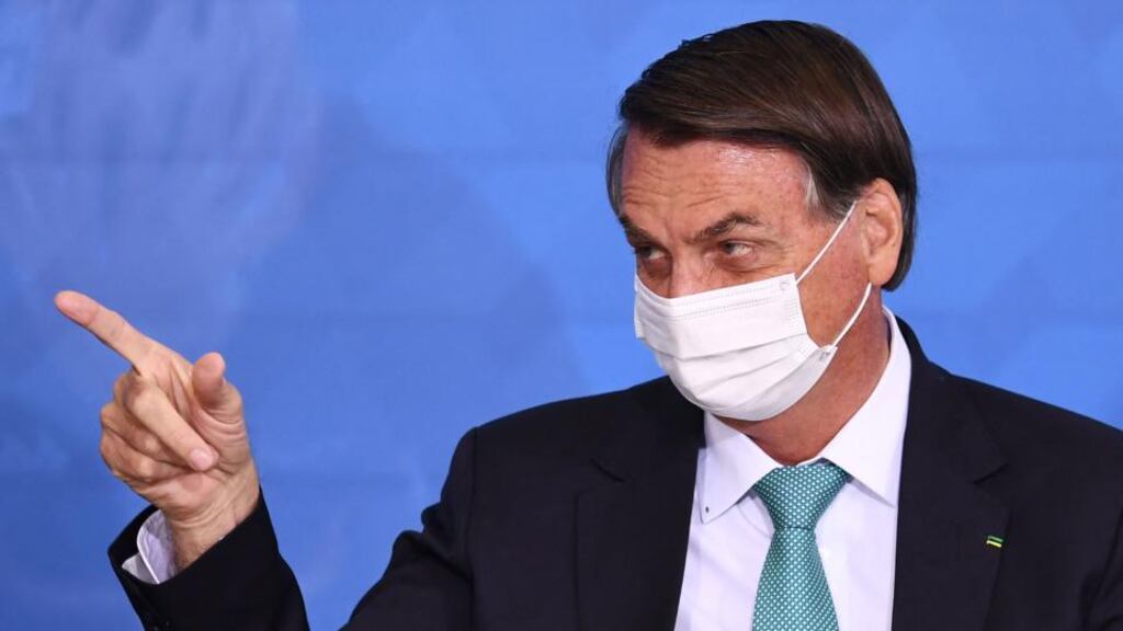 The increasingly distrusted  president Jair Bolsonaro told Brazilians repeatedly that they had nothing to fear from the disease, ‘a little flu’, and promoted and distributed quack remedies. Photograph: Evaristo Sa/AFP via Getty