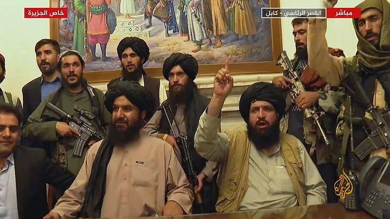 Members of  theTaliban inthe presidential palace in Kabul on Monday. Photograph: Al Jazeera/AFP via Getty Images