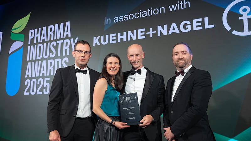 Seamus Keane, vice president pharma and healthcare Europe at Kuehne + Nagel, presents the pharma industry company of the year to the Bristol Myers Squibb team