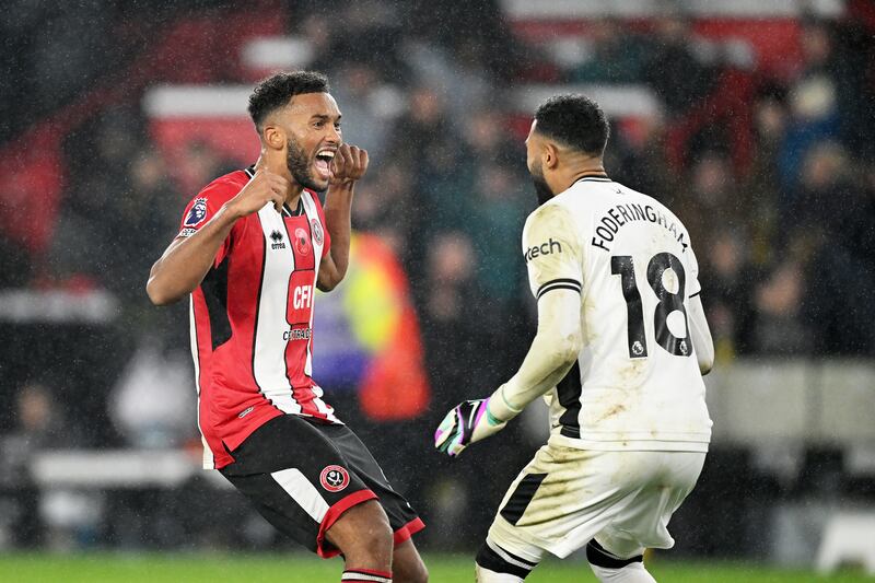 Auston Trusty and Wes Foderingham of Sheffield United celebrate following the team's victory during the Premier League match between Sheffield United and Wolverhampton Wanderers. Photograph: Michael Regan/Getty Images