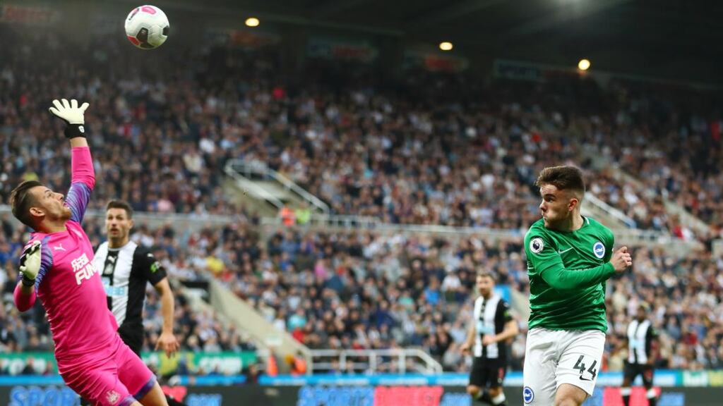 Brighton’s Aaron Connolly lifts a shot over Newcastle goalkeeper Martin Dubravka only to see his goal-bound shot cleared off the line by Fabian Schar during the Premier League game at St James’ Park. Photograph: Dan Istitene/Getty Images