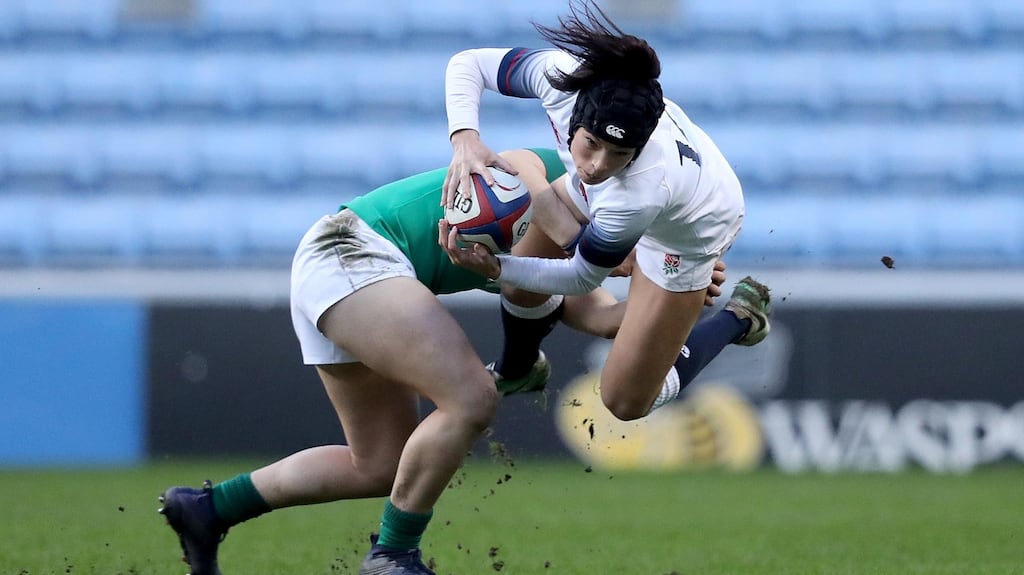 England’s Kelly Smith is tackled by Katie Fitzhenry of Ireland during the Women’s Six Nations match at the Ricoh Arena in Coventry. Photograph: Tommy Dickson/Inpho
