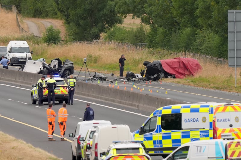 Gardaí at the scene following a fatal collision on the M9 near Moone, Co Kildare, on Sunday morning. Photograph: Niall Carson/PA Wire
