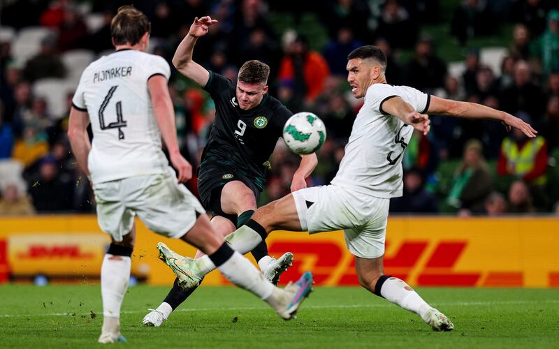 Ireland's Evan Ferguson and New Zealand's Michael Boxall. Photograph: Ryan Byrne/Inpho