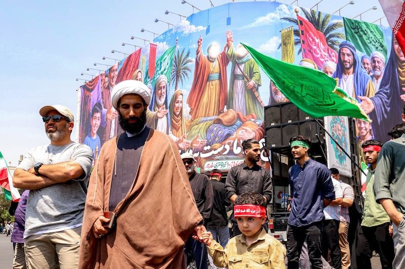 People gather for a protest against Israel's wave of strikes on Iran in Enghelab (Revolution) Square in central Tehran on June 13. Photograph: Atta Kenare/ AFP via Getty Images