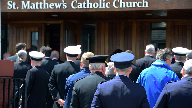 Members of the Irish Coast Guard arrive at St Matthew’s Church in Ballyfermot, Co Dublin. Photograph: Cyril Byrne/The Irish Times