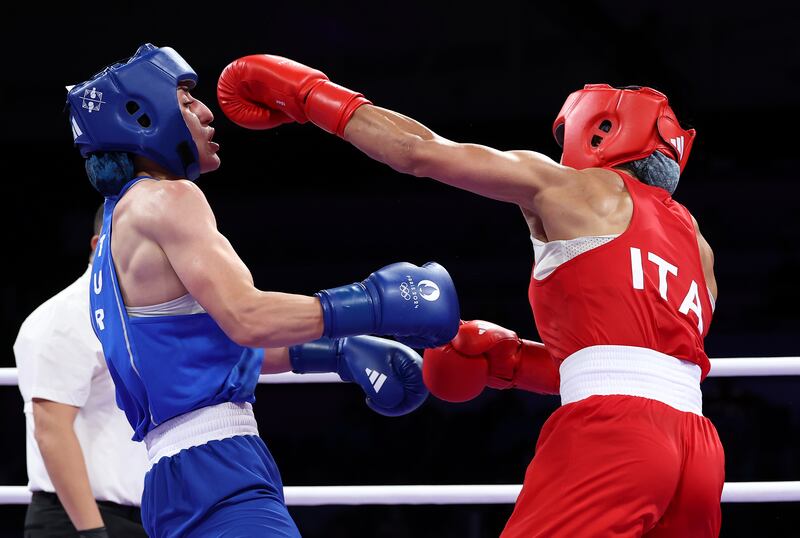 Gizem Ozer of Team Turkey dodges a punch from Alessia Mesiano of Team Italy during on day one of the Olympic Games Paris 2024. Photograph: Richard Pelham/Getty Images